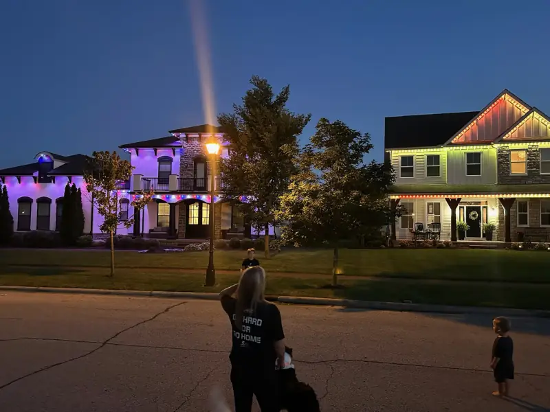 Two neighboring homes with permanent lights in Columbus Ohio neighborhood