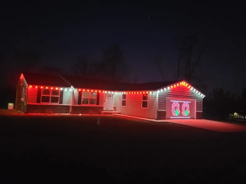 Govee permanent lights used as accent lighting with soft color tones along the house